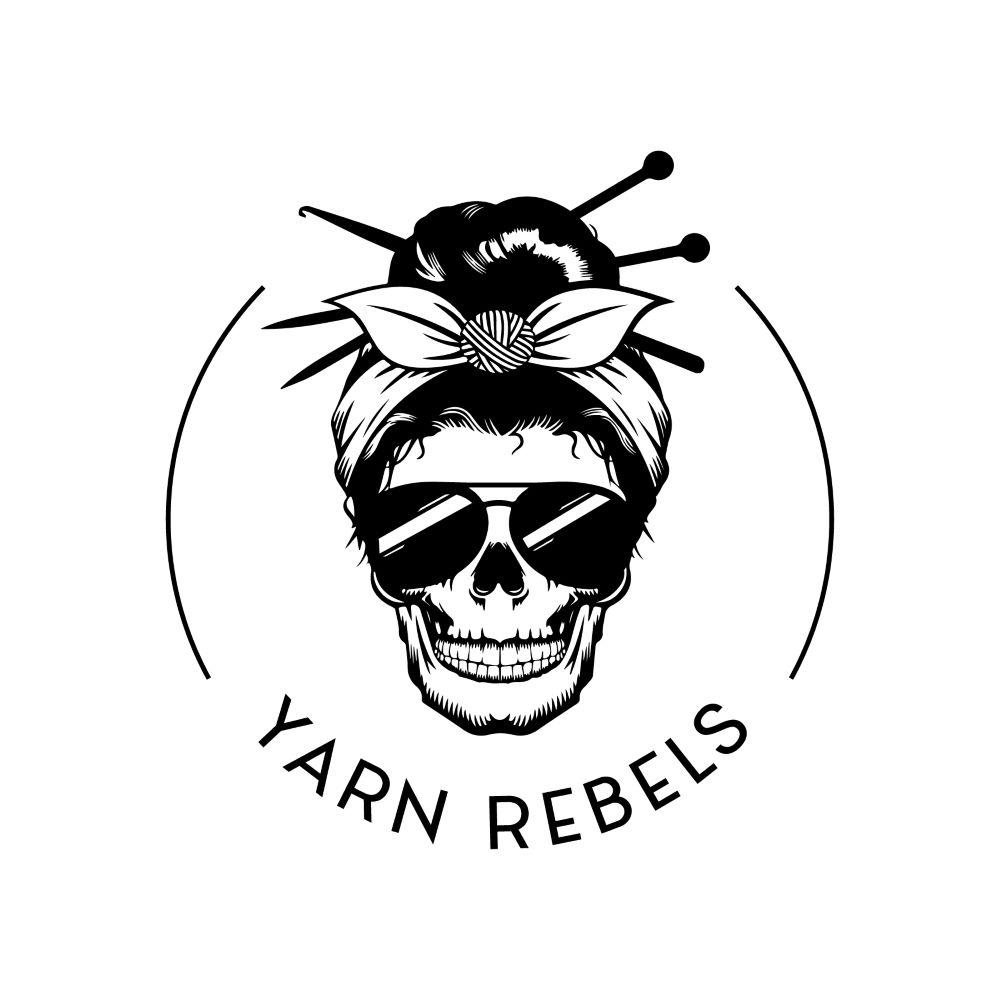 Yarn Rebels logo. Skull wearing shades with knitting needles in hair